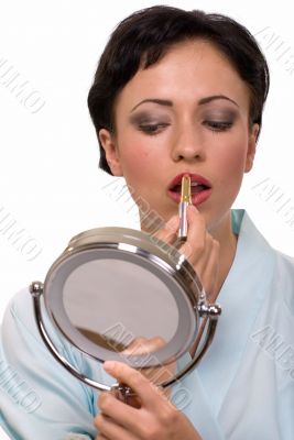 Woman putting on makeup