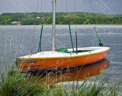 Orange boat on the lake