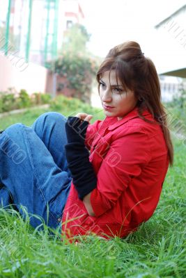 beautiful woman sitting on grasses