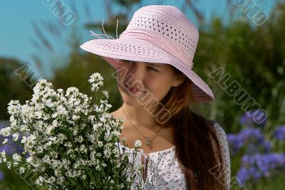 girl in a hat with flowers
