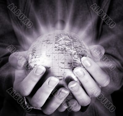 Globe in a girl`s hands