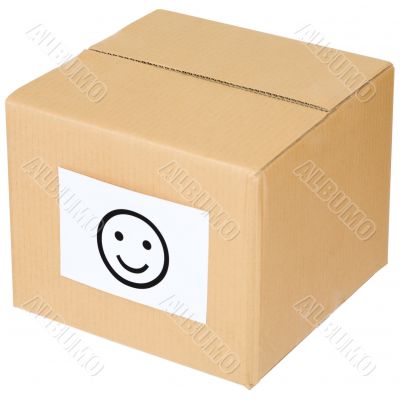 Cardboard box with a smiley sign