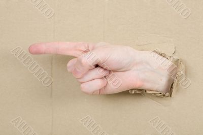 Gesture male hand through cardboard