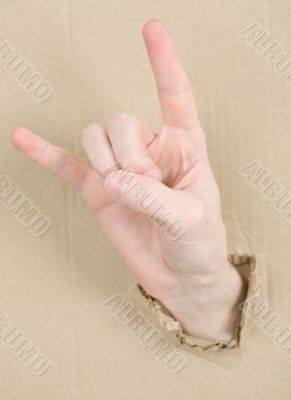 Gesture male hand through cardboard