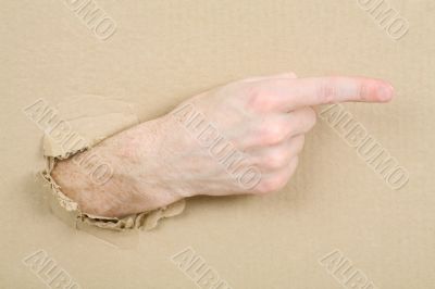 Gesture male hand through cardboard