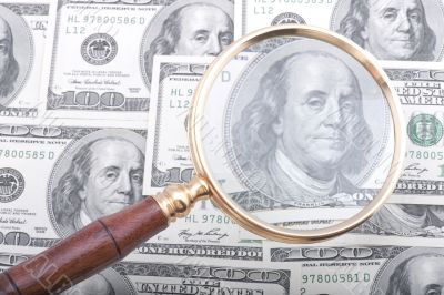 magnifier glass with money