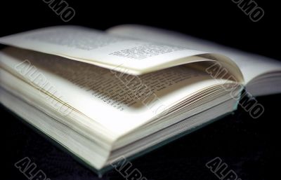 Open book on black