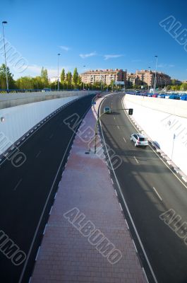 cars driving out city tunnel