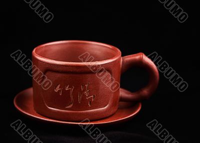 Brown cup and saucer
