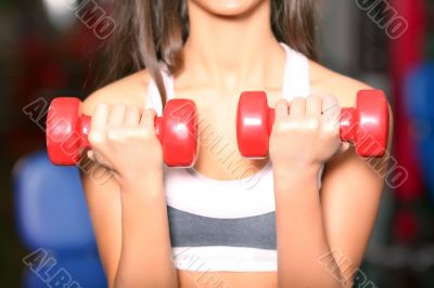 The girl with dumbbells