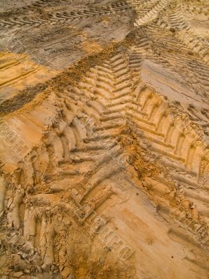 Car traces in sand