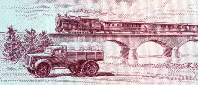 Truck and steam passenger train crossing viaduct