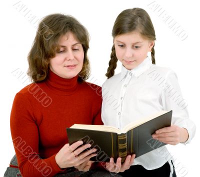 Woman and girl reads a book
