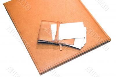 bisness card and cardholder on notebook