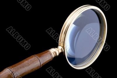 magnifying glass on black close up
