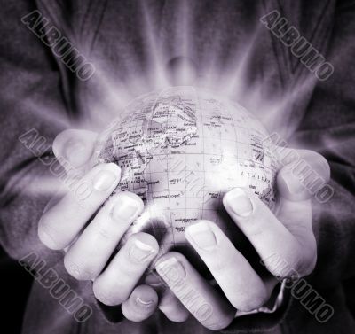 Globe in a girl`s hands