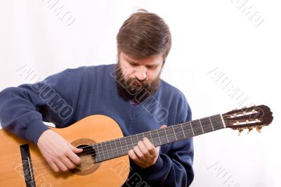 playing on acoustic guitar