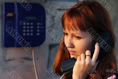 Girl talking by the phone
