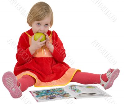 Little girl with book and apple