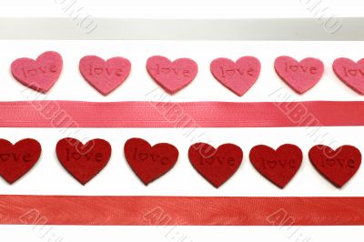 A lot of red and pink hearts with colours ribbons