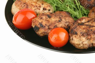 Cutlets and tomatoes