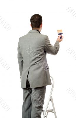Businessman Painting A Sign