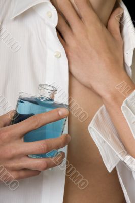 Man with perfume bottle