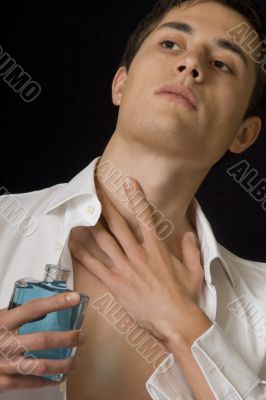 Man with perfume bottle