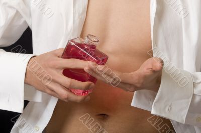 Man with perfume bottle
