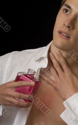 Man with perfume bottle