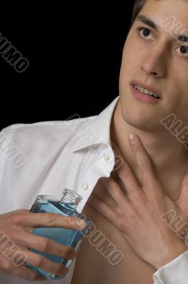 Man with perfume bottle