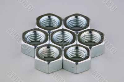 Seven metal nuts