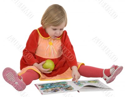 Small girl looking book