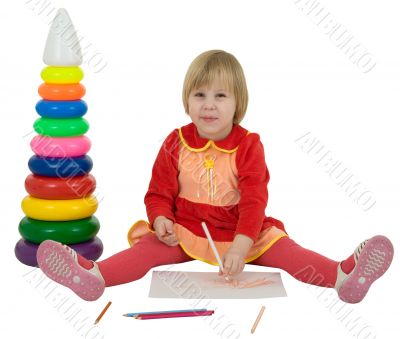 Little girl and crayons and toy pyramid