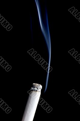 cigarette with smoke on black