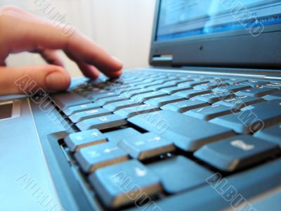 computer keyboard with human hand