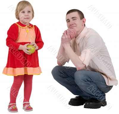 Little girl with green apple and young man