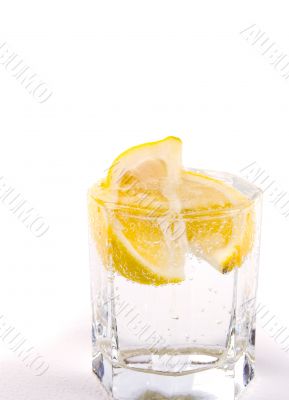 glass with soda water and lemon