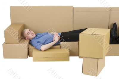 Man with carton TVset and sofa