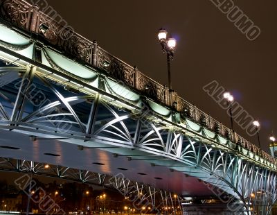Highlighted bridge over the river at night