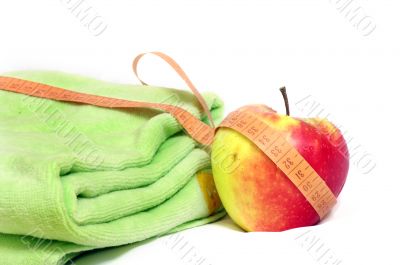 apple and measuring tape isolated on white background