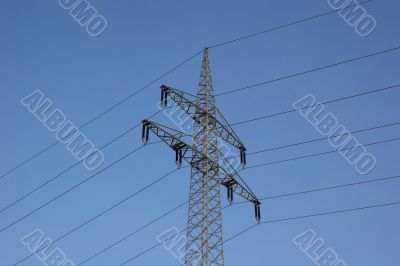 Power line in front of blue sky