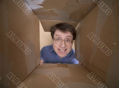 Man portrait inside carton box