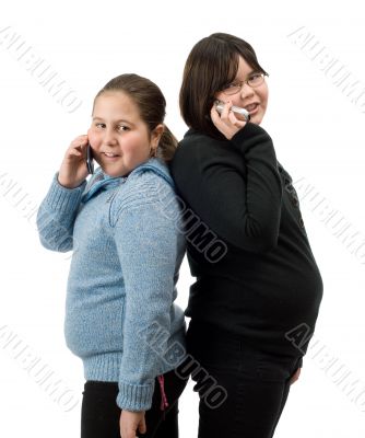 Two Girl On Their Cell Phones