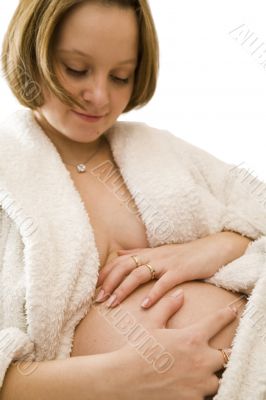 pregnant woman holding her belly