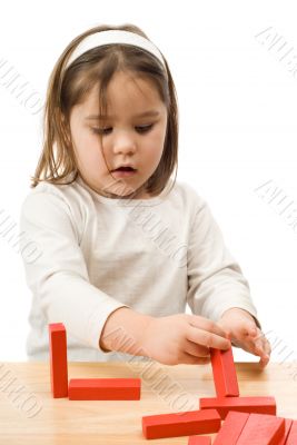 Child Playing With Block