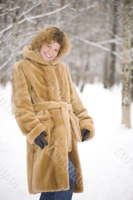 Portrait woman in the fur coat