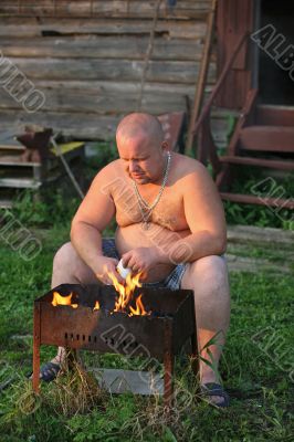 The man makes fire