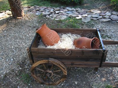  wooden dray and fictile jugs