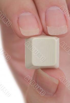 Hand holds a computer key